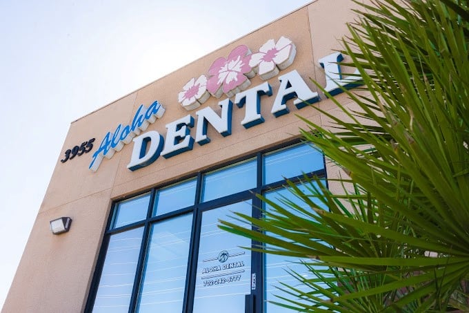 Aloha Dental storefront in Las Vegas with blue and pink signage on tan building exterior